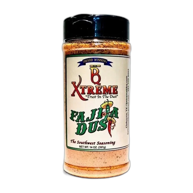 Bottle of B Xtreme BBQ Fajita Dust with grilled fajitas, peppers, and lime slices on a wooden board