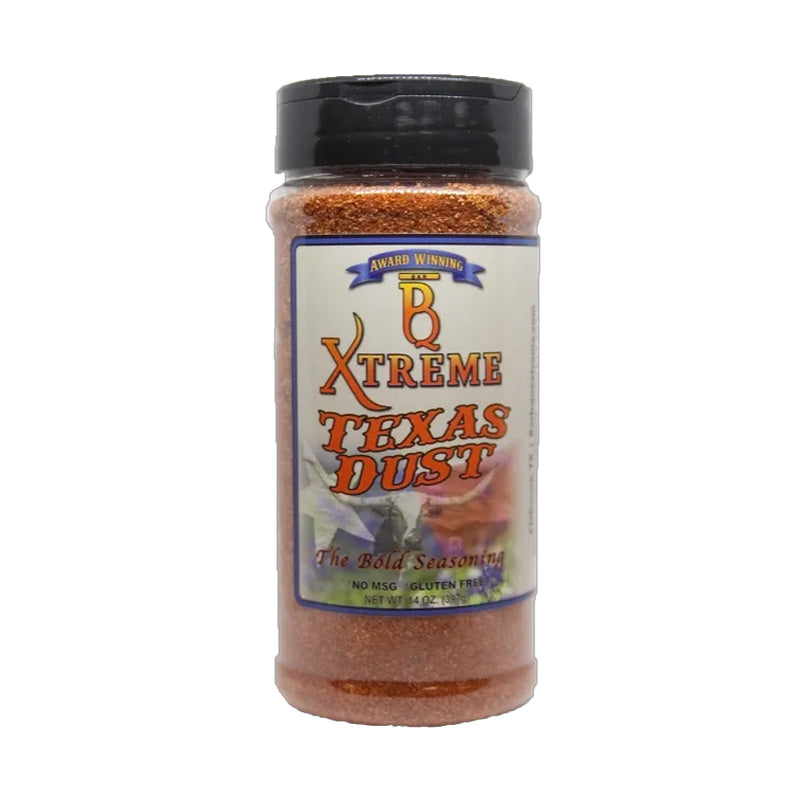 Bottle of B Xtreme BBQ Texas Dust with smoked brisket, ribs, and peppers on a rustic board