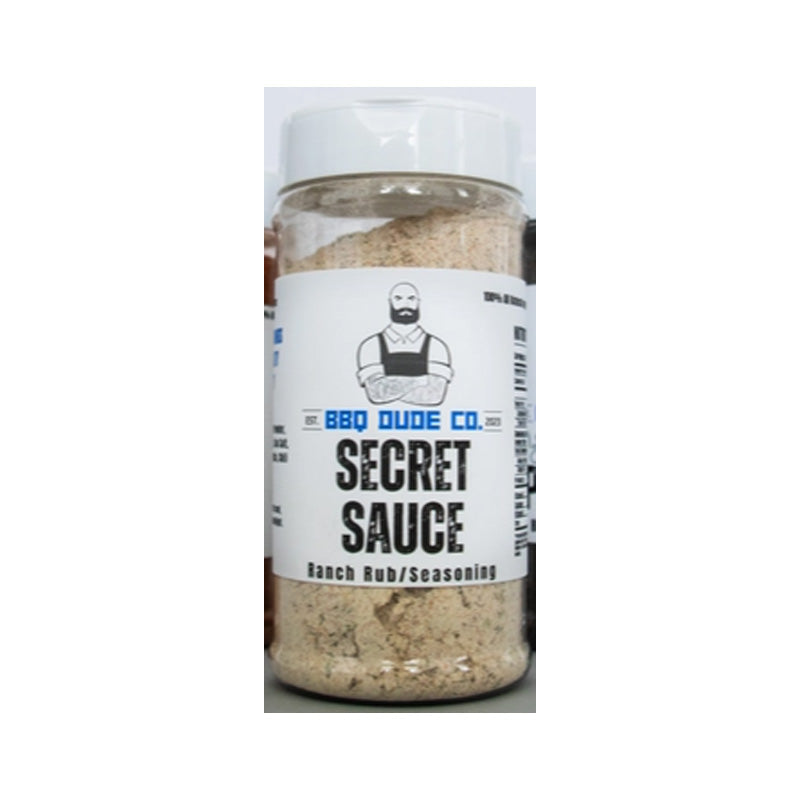 BBQ Dude Secret Sauce Ranch Seasoning bottle beside ranch dip and grilled chicken.