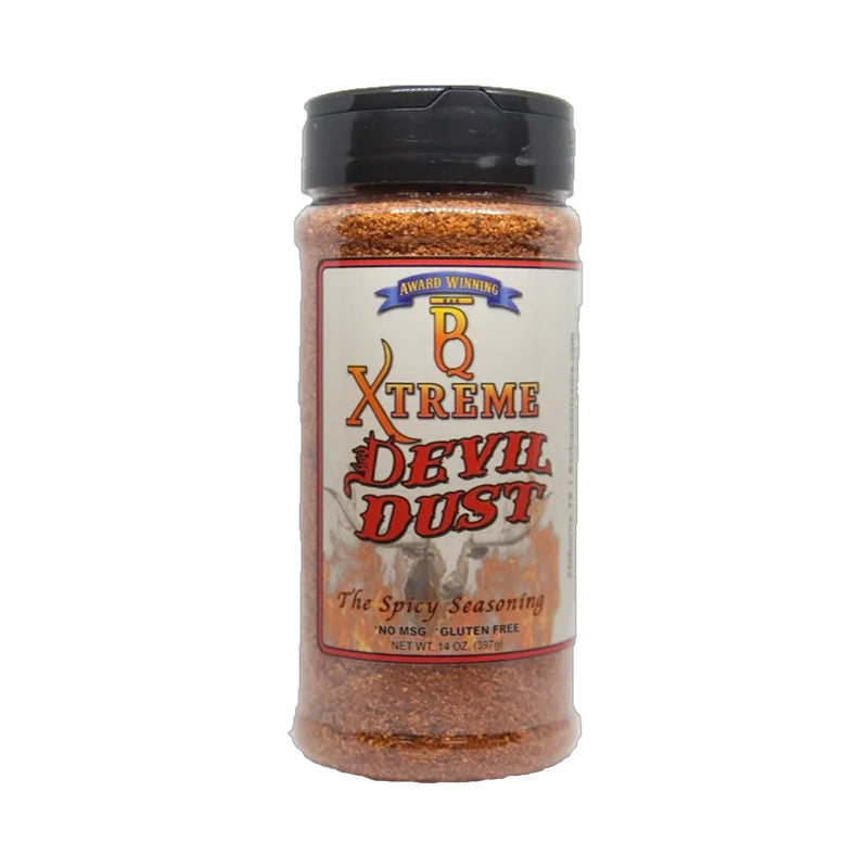 B Xtreme BBQ Devil Dust bottle surrounded by flames and grilled wings