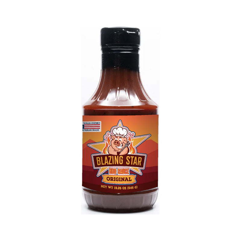 Bottle of Blazing Star Original BBQ Sauce beside glazed ribs and pulled pork