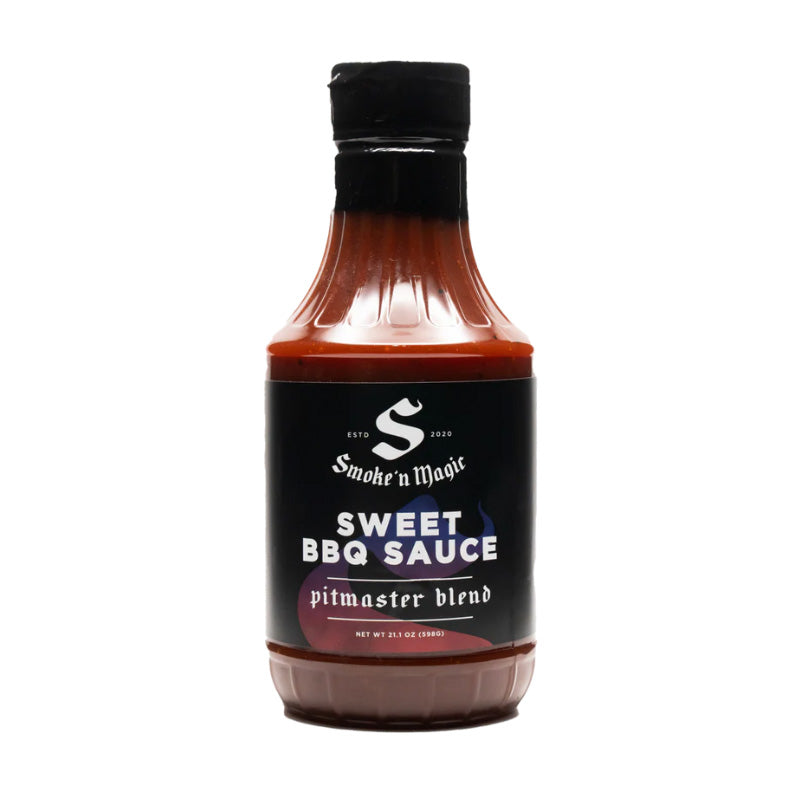 Bottle of Smoke ’N Magic Sweet BBQ Sauce beside glazed ribs and pulled pork